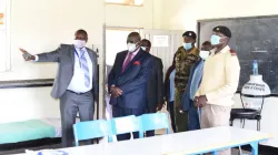 Kenya's Education Cabinet Secretary George Magoha inspects a room set aside by the Heri Healthcare team for treatment of students at a Kenyan school / Heri Healthcare