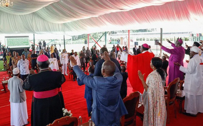 Religious Leaders, dignitaries, and other invited guests raise their hands in a gesture of worship during the National Prayer Day held at State House Nairobi on March 21, 2020. / State House, Nairobi Kenya.