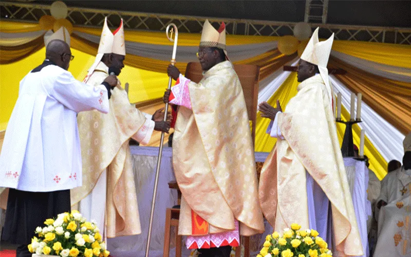 Outgoing Kericho Bishop, Emmanuel Okombo hands over the crosier to Bishop Alfred Rotich. The crosier is a sign of a bishop's authority and jurisdiction. / ACI Africa