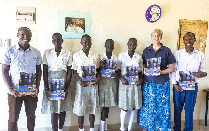 The Principal of Loreto Girls' Secondary School, Rumbek Diocese, South Sudan, Sr. Orla Treacy (2nd from right) with some students and staff display the first edition of their School Magazine launched in November 2019. / Loreto Girls' Secondary School, Rumbek Diocese, South Sudan.