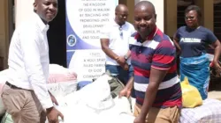 Members of the Association of Catholic Journalists in Southern Malawi donate a disaster relief package to flood victims. Credit: Chikwawa Diocese