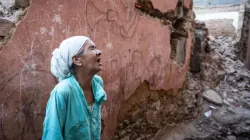 A woman reacts standing in front of her earthquake-damaged house in the old city in Marrakesh on Sept. 9, 2023. A powerful earthquake that shook Morocco late Sept. 8 killed more than 1,000 people, the government said on Sept. 9, sending terrified residents fleeing their homes in the middle of the night. | Credit: Fadel Senna/AFP via Getty Images)