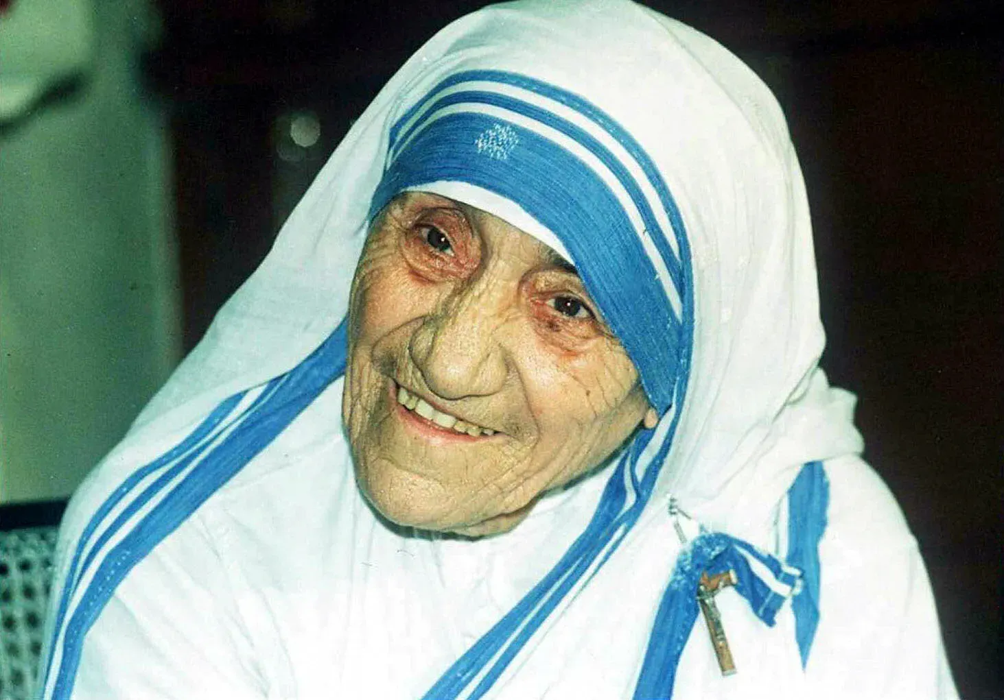 Mother Teresa smiles as she poses for photographers in Calcutta, India, on April 12, 1995. STR/AFP via Getty Images