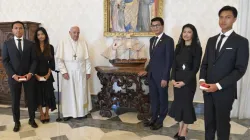 Pope Francis poses next to a miniature model of a ship with Madagascar's President Andry Nirina Rajoelina and his family in the Vatican's apostolic palace on Aug. 17, 2023. | Vatican Media.