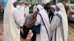 Bishop Eugenio Salazar Mora kneels before the superior of the Missionaries of Charity expelled from Nicaragua on July 6, 2022. Credit: Facebook / Video capture