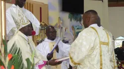 Bishop John Mbinda presenting the Book of the Gospels to newly ordained Deacons. Credit: ACI Africa
