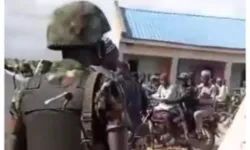 Screengrab from video showing soldiers in Nigeria interacting freely with suspected bandits Credit: The Truth Nigeria