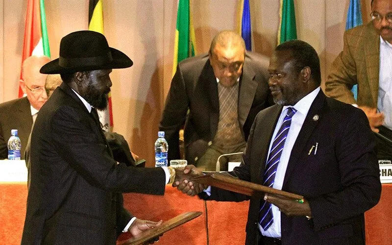 South Sudan's President Salva Kiir (left) and Vice-president Riek Machar (right) shake hands at the signing of the Revitalized Agreement on the Resolution of Conflict in South Sudan (R-ARCSS) in September 2018.