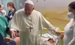Pope Francis baptizes a baby at Gemelli Hospital in Rome on March 31, 2023. | Credit: Screen shot of Vatican Media video
