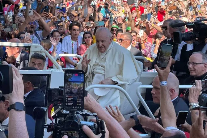 Pope Francis makes his way past crowds of thousands on his way to the World Youth Day welcoming ceremony in Lisbon, Portugal, Aug. 3, 2023. | Credit: Pablo Pilco/EWTN News