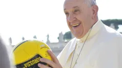 Pope Francis holds a soccer ball in St. Peter's Square during the Wednesday general audience on Aug. 26, 2015. L'Osservatore Romano.