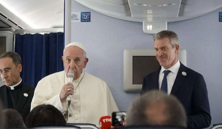 Pope Francis speaks aboard a Nov. 26 flight from Tokyo to Rome. Credit: Hannah Brockhaus/CNA