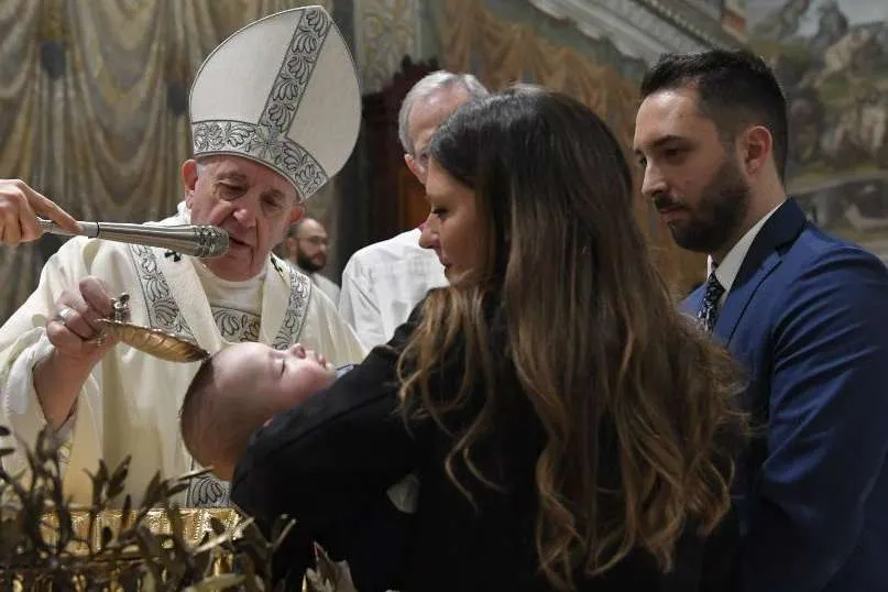 Pope Francis baptizes a child in the Sistine Chapel on Jan. 12, 2020. Credit: Vatican Media.