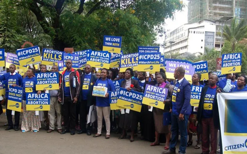 Protesters holding placards in Nairobi against ICPD25 on the eve of the convention on November 11, 2019