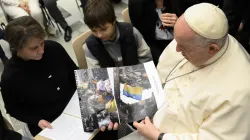 Pope Francis looking at images from Ukraine at the general audience, Dec. 21, 2022 | Vatican Media
