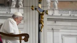 Pope Francis prays in front of a crucifix during his general audience on Oct. 26, 2022. | Vatican Media