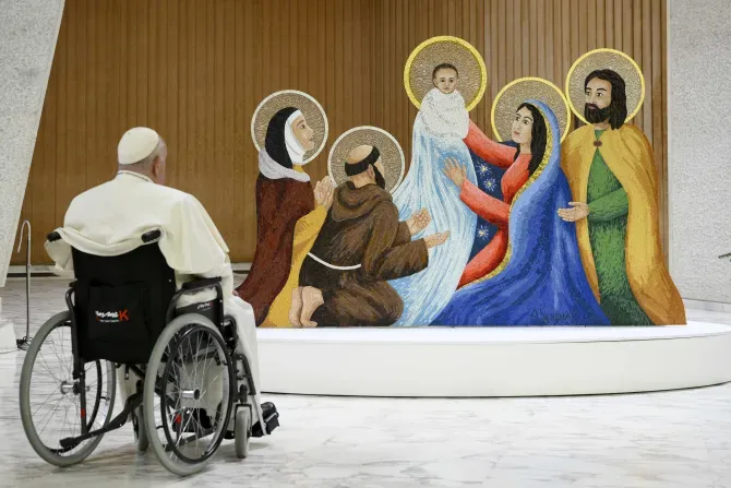 Pope Francis gazes at a nativity scene during a meeting with two delegations at the Vatican Dec. 9, 2023 — a community from Macra, located in the Alps who provided this year’s Christmas tree, and people from the Diocese of Rieti, who donated this year's Nativity scene. | Credit: Vatican Media
