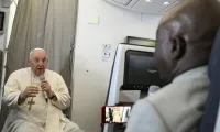 Pope Francis speaks to journalists on Feb. 5, 2023, during his flight back to Rome after his visit to the Democratic Republic of Congo and South Sudan. / Vatican Media