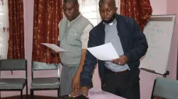 The incoming RSCK Chairman, Fr. Robert Karanja Ireri  (R) and the Vice Chairman, Br. Placid Kaburu (L) taking oath of office soon after their October 14 election during RSCK's annual general meeting in Nairobi. / Courtesy