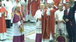 Archbishop Domenico Battaglia holds up the reliquary with the liquefied blood of St. Januarius on the martyr bishop's feast day Sept. 19, 2023. The announcement that the blood had liquefied was made at the start of Mass in the Naples Cathedral by Abbot Vincenzo De Gregorio. | Screenshot / YouTube channel Chiesa di Napoli