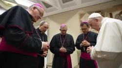 Pope Francis prays with French bishops before his general audience, Oct. 6, 2021, in the wake of a devastating abuse report. Vatican Media.