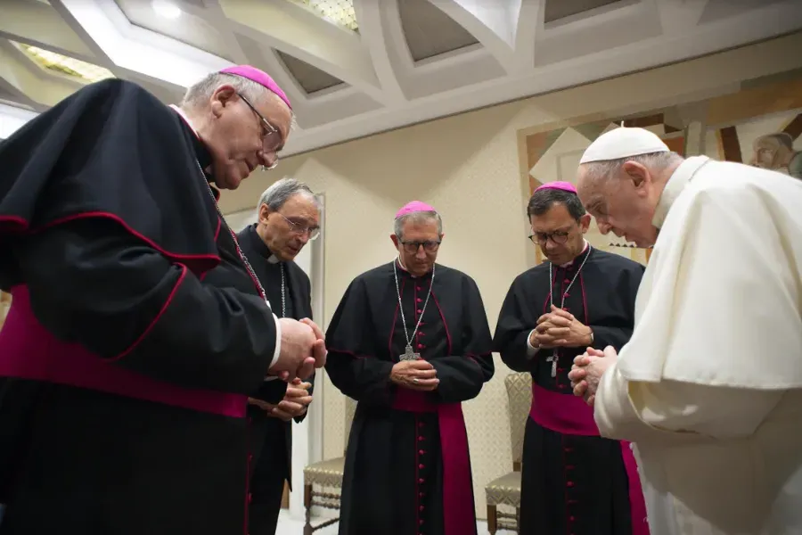 Pope Francis prays with French bishops before his general audience, Oct. 6, 2021, in the wake of a devastating abuse report. Vatican Media.