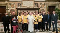 Pope Francis with members of the ‘Pope’s Team - Fratelli tutti’ in the Vatican’s Clementine Hall, Nov. 20, 2021. Vatican Media.