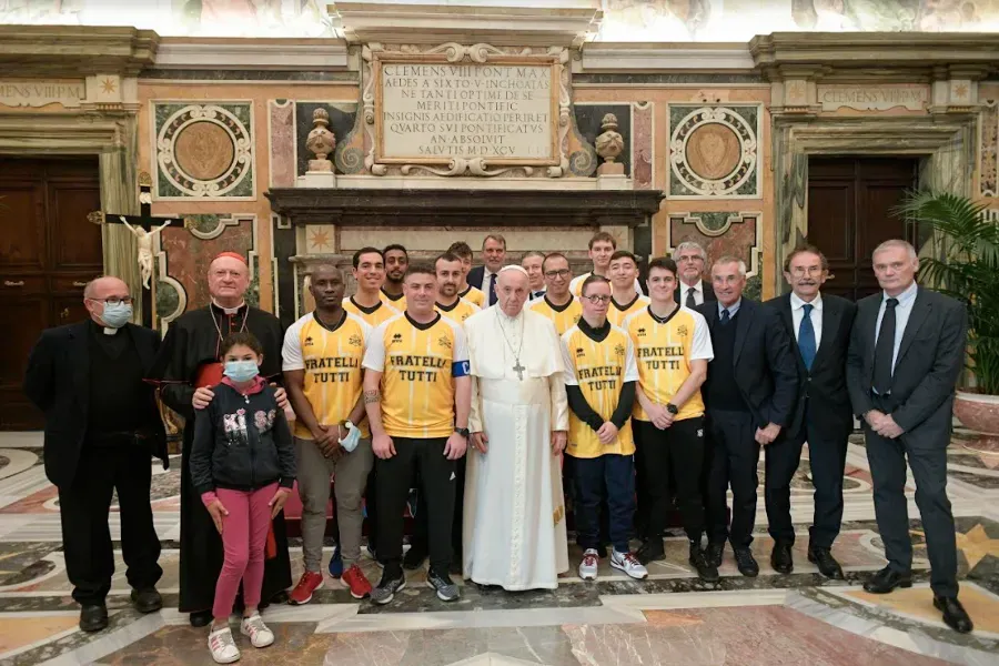 Pope Francis with members of the ‘Pope’s Team - Fratelli tutti’ in the Vatican’s Clementine Hall, Nov. 20, 2021. Vatican Media.