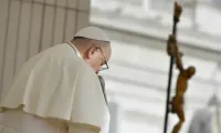 Pope Francis prays during his Wednesday general audience on 15 November 2023. | Credit: Vatican Media