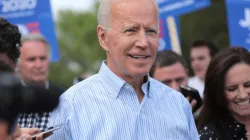 Joe Biden walking with supporters in Iowa, May 25, 2020. / Pix_Arena/Shutterstock