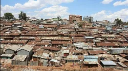 Image showing an open sewer running behind numerous corrugated houses at Mukuru kwa Njenga in Nairobi, Kenya. / courtesy