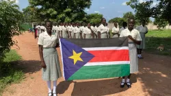 Students of Loreto Girls' Secondary School in the Diocese of Rumbek, South Sudan, holding South Sudan Flag on 10th anniversary of independence on 9 July 2021/ Credit: Sr. Orla Treacy, Loreto Sisters, Rumbek