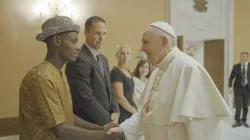 Pope Francis meets Arouna Kandé, one of the subjects of the documentary “The Letter.” | Photo credit: Laudato Si’ Movement