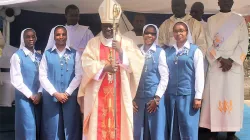 Archbishop Philip Anyolo of Nairobi Archdiocese with the four Sisters of daughters of St. Paul who took their final religious profession. Credit: ACI Africa.