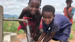 Some children at a solar-powered well sponsored by Water 4 Mercy. Credit: Water 4 Mercy