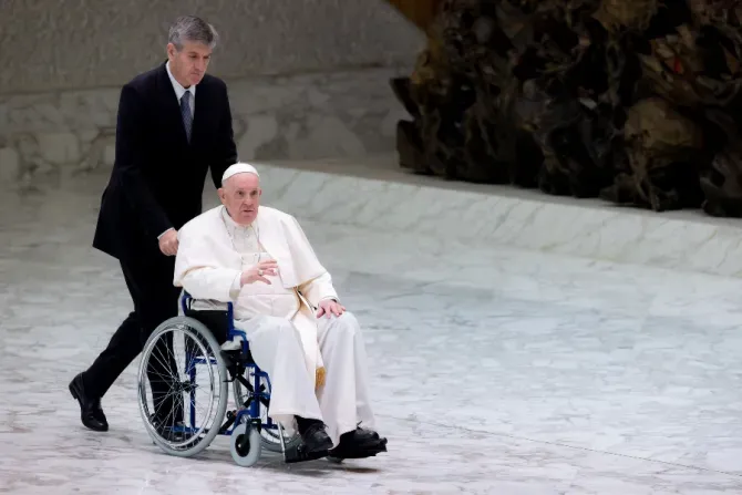 Pope Francis enters the Vatican’s Paul VI Hall in a wheelchair on May 5, 2022. | Daniel Ibáñez/CNA.