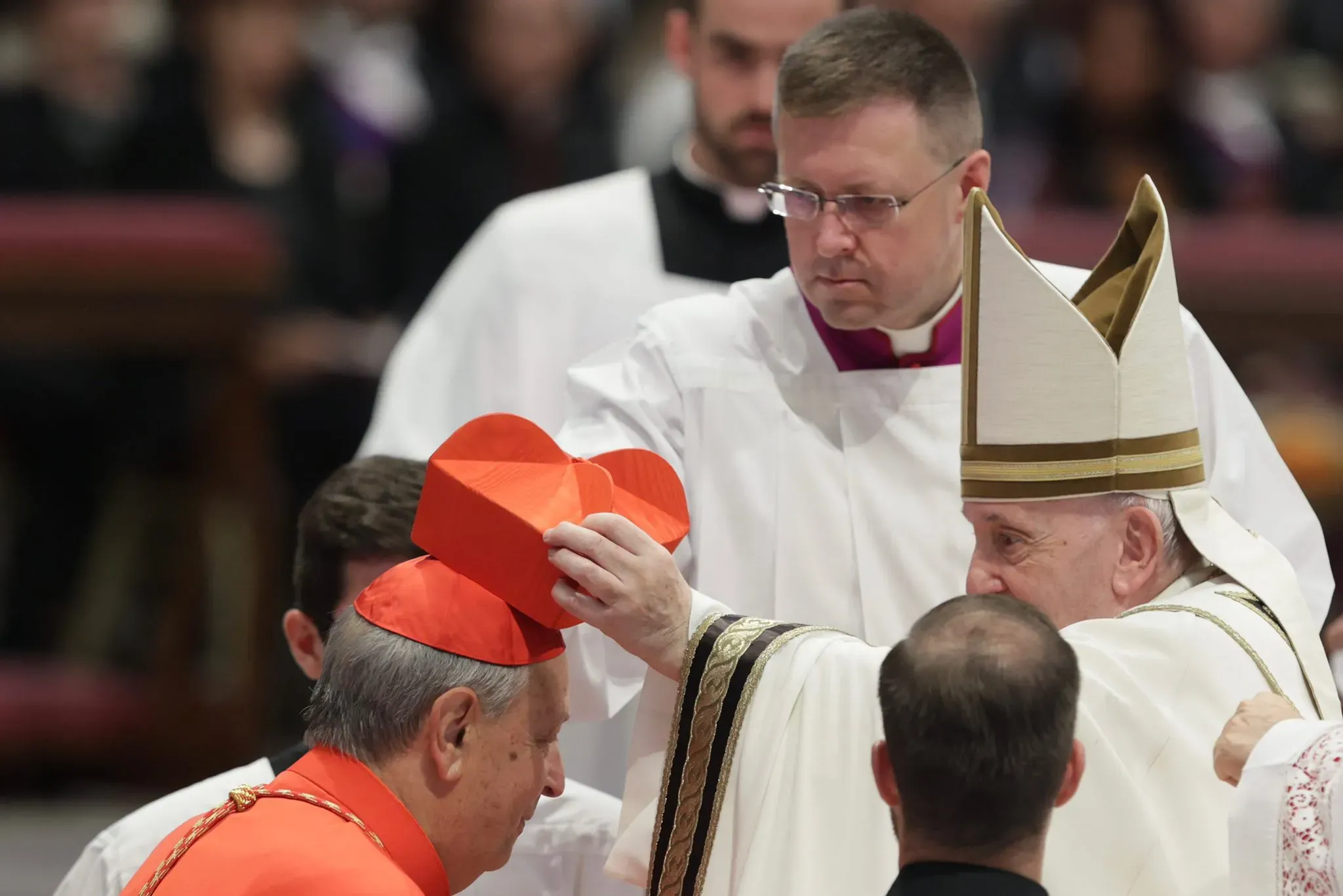 Cardinal Oscar Cantoni, bishop of Como, receives the red biretta from Pope Francis at the consistory in St. Peter's Basilica, Aug. 27, 2022. Daniel Ibáñez / CNA