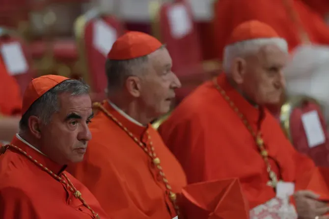 Cardinal Angelo Becciu (left) at the consistory in St. Peter's Basilica, Aug. 27, 2022. | Daniel Ibáñez / CNA