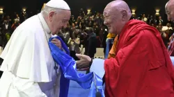 Khamba Nomun Khan, the head of the Gandan Monastery in Ulaanbaatar, accompanied Pope Francis as he made his entrance at the interreligious dialogue event at the Hun Theater in Mongolia on Sept. 3, 2023. | Vatican Media