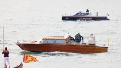 Pope Francis waves while traveling by boat in Venice, Italy, for a meeting with young people at the Basilica della Madonna della Salute on April 28, 2024. Earlier in the day he met with inmates at a women's prison. / Credit: Daniel Ibañez/CNA