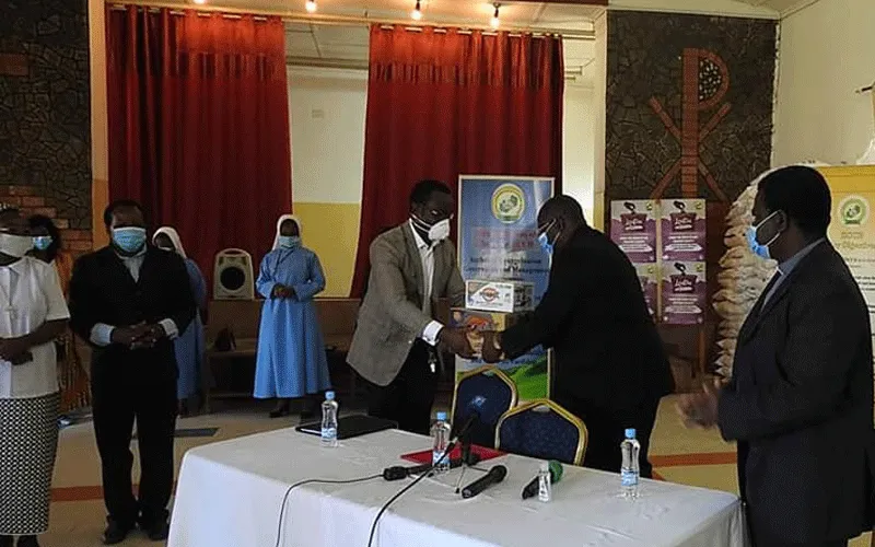(ZCCB) Representative, Bishop Moses Hamungole receives donation on behalf of the Conference. / Caritas Zambia