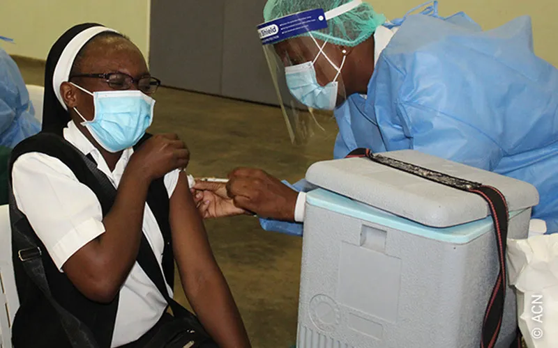 A Catholic Nun getting a COVID-19 inoculation at a medical center in Zimbabwe. Credit: Aid to the Church in Need (ACN)