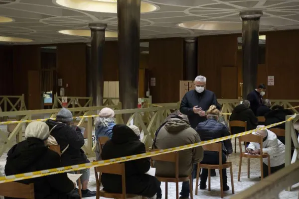 Papal almoner Cardinal Konrad Krajewski with homeless people awaiting vaccinations in the atrium of the Paul VI Hall at the Vatican Jan. 20, 2021. Credit: Vatican Media.