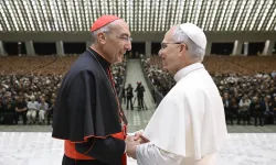 Pope Leo XIV shakes hands with Cardinal Baldassare Reina, vicar general of Rome, during a meeting with priests of the Rome Diocese at the Vatican on June 12, 2025. | Credit: Vatican Media