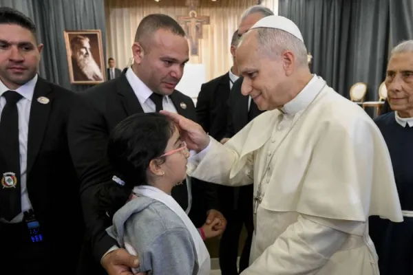 Pope Leo XIV blesses a child at the De La Croix Hospital for the mentally disabled in Jal el Dib, north of Beirut, Lebanon, on Dec. 2, 2025. | Credit: Vatican Media