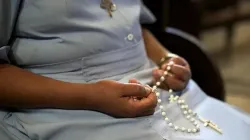 An African nun prays the rosary. On Jan. 7, 2025, two religious sisters were kidnapped in the Archdiocese of Onitsha in Nigeria. / Credit: Diego Cervo/Shutterstock.