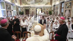 Pope Leo XIV greets French altar servers during an audience on Aug. 25, 2025, at the Vatican. / Credit: Vatican Media