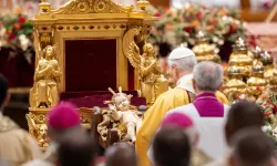 Pope Leo XIV venerates a statue of the Child Jesus during the celebration of Christmas Mass during the Night in St. Peter's Basilica on Dec. 24, 2025. / Credit: Daniel Ibanez/CNA.