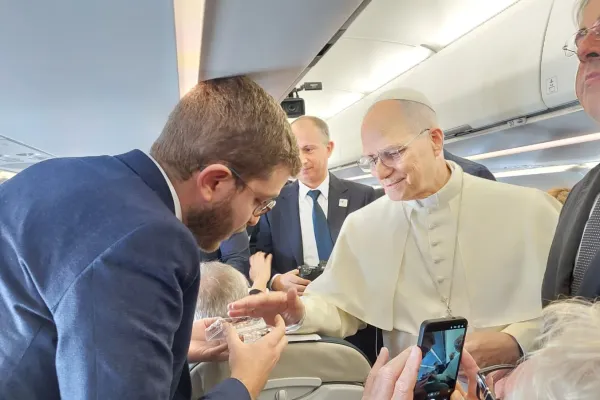Pope Leo XIV blesses rosaries for EWTN News' Elias Turk aboard the papal plane to Ankara, Turkey, on Nov. 27, 2025. / Credit: Courtesy Elias Turk of EWTN News.