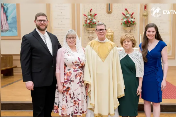 Father Travis Moger on the day of his ordination alongside his son, Mark; wife, Amelia; mother; and daughter, Maddy. | Credit: EWTN News screenshot
